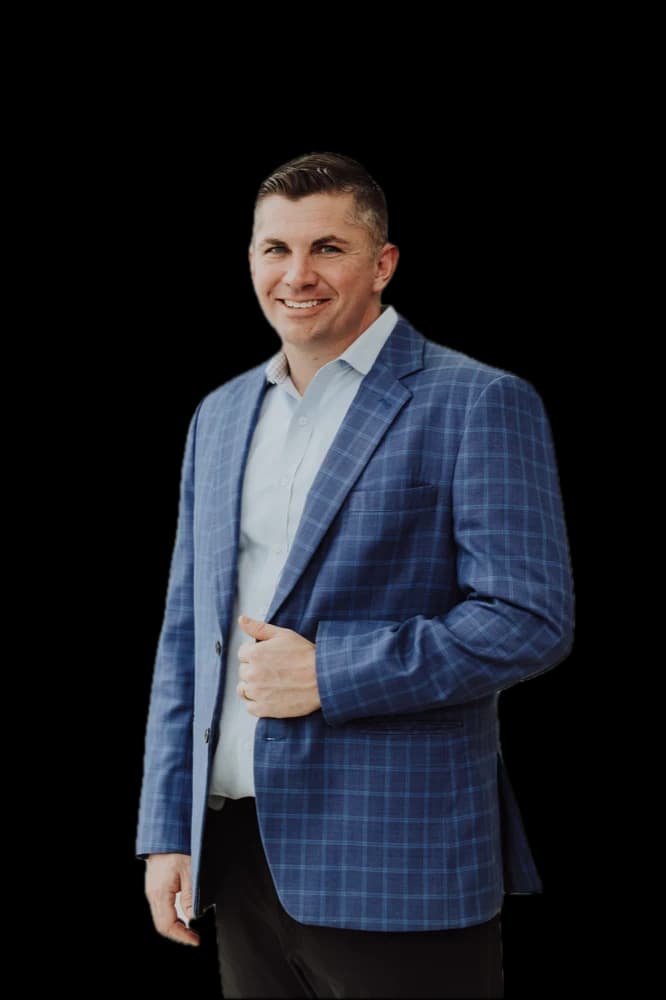 Rennie Barton, REALTOR® / Owner of City2Shore Arete Collection, in a blue suit